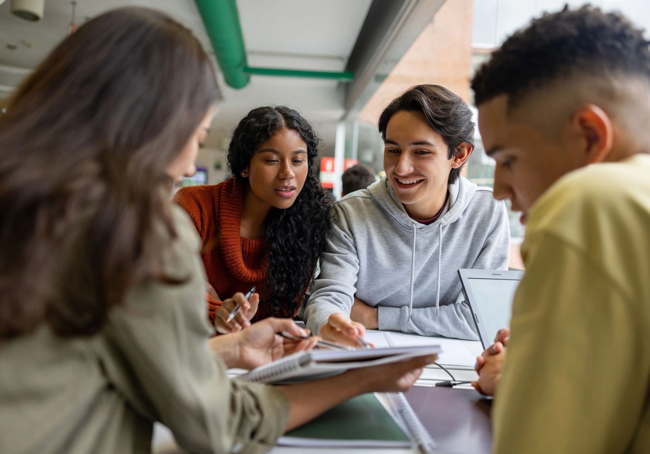 students collaborating in school